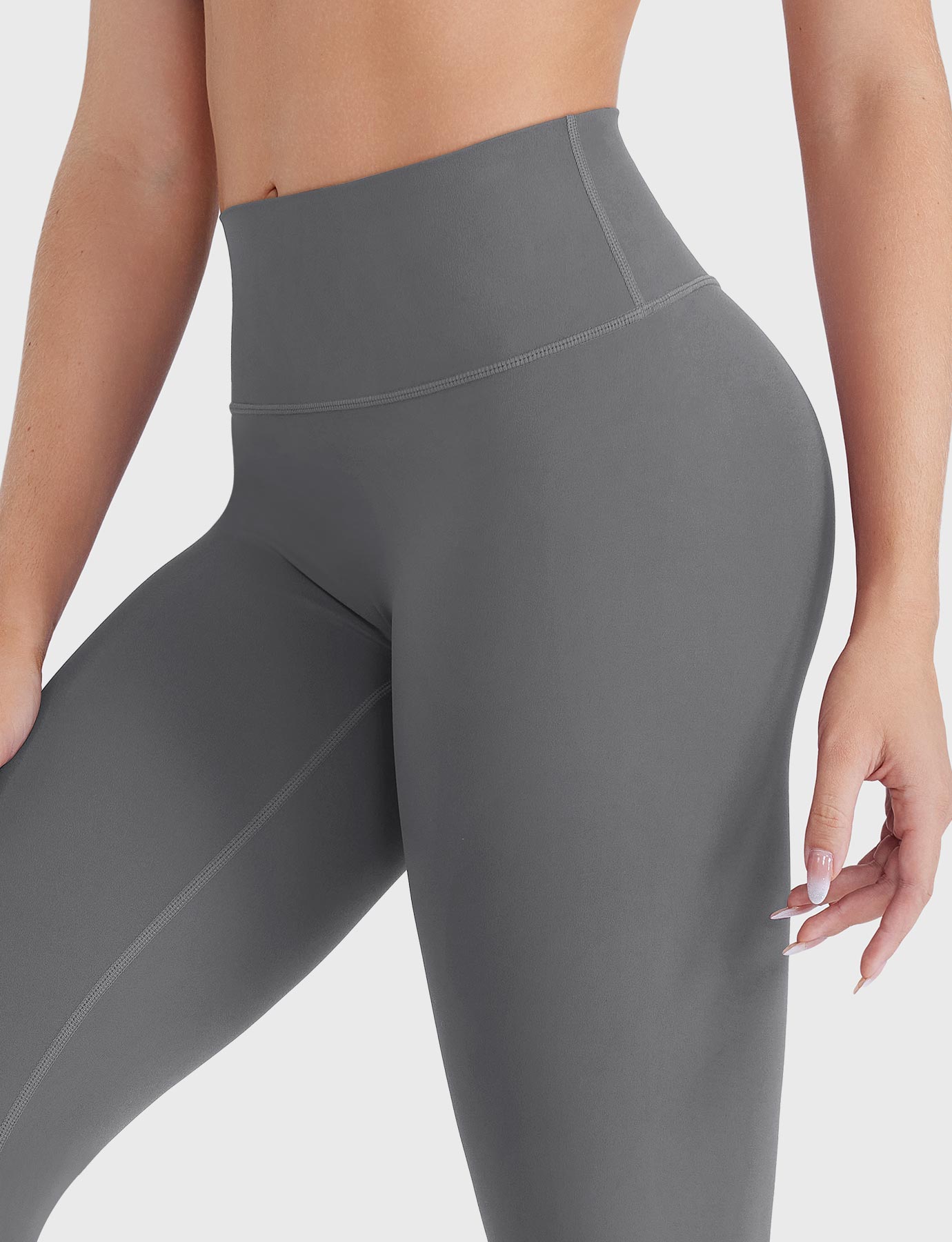 Close-up of Lara Smoke high-rise leggings with no front seam, waistband detail