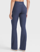 Navy hidden-scrunch bootcut leggings, clean back view