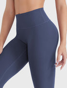 Close-up of navy high-rise no-front-seam leggings, waistband detail