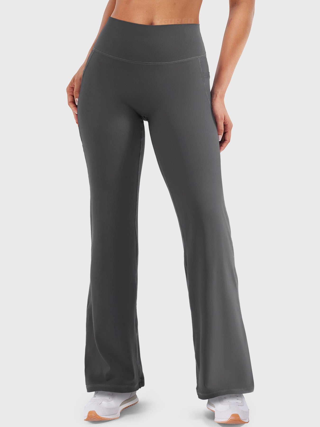 Front view—model wearing dark grey high waisted straight leg leggings with no front seam