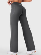 Walking side-back view in dark grey straight leg leggings with pockets, casual daily wear