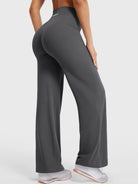 Side-back view showing dark grey straight leg leggings with subtle V-back shaping