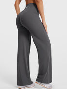 Dark grey straight leg leggings showing natural lift from back angled view, flattering athletic fit