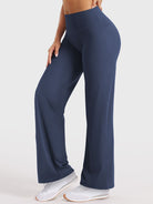 Side-front pose wearing navy straight leg leggings with pockets, high waisted fit, 29-inch inseam