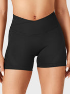 Black Baderiy 4.5" V-cross waistband seamless shorts front view, high-rise waist defining an hourglass silhouette without front seam