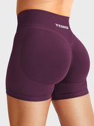 Black Cherry Baderiy 4.5" V-waistband seamless shorts angled back view, subtle glute contour for natural butt lift
