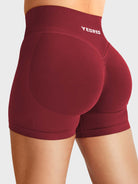 Scarlett Red Baderiy 4.5" V-waistband seamless shorts angled back view, subtle glute shaping with natural butt lift