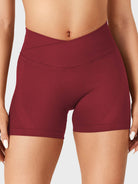 Scarlett Red Baderiy 4.5" V-cross waistband seamless shorts front view, high-waisted design accentuating an hourglass shape