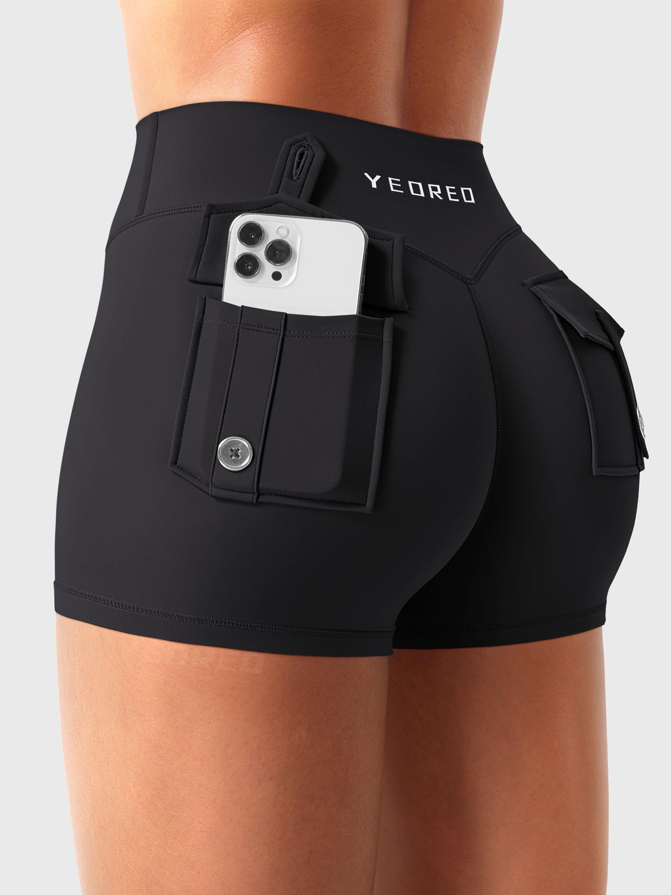 Black Yeoreo Darilya CoreFlex low rise cargo shorts angled back view, dual cargo pockets providing functional storage