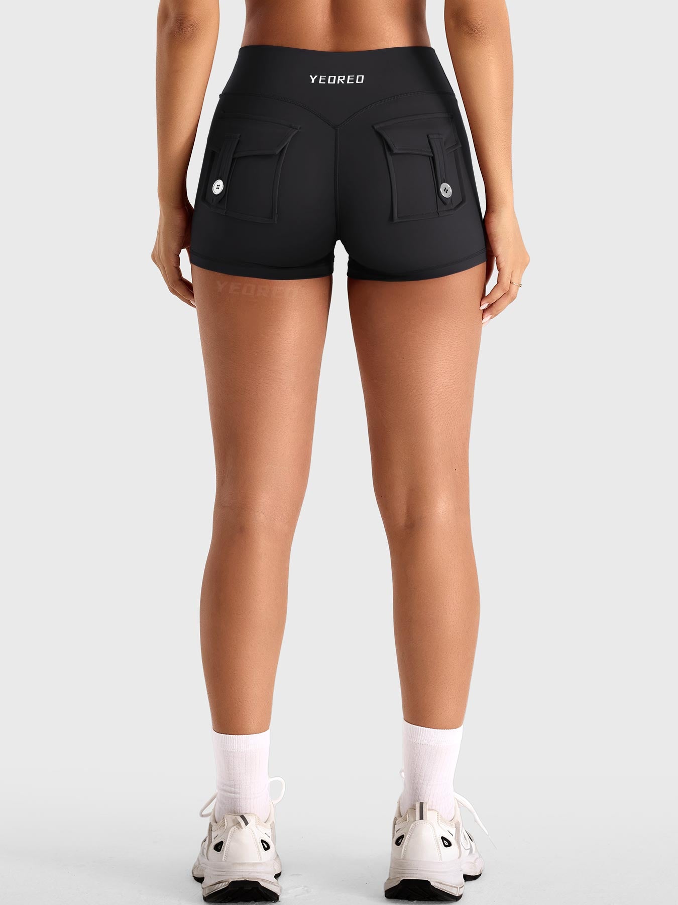 Black Yeoreo Darilya CoreFlex cargo shorts back view, dual rear cargo pockets and sculpting V-back design