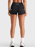 Black Yeoreo Darilya CoreFlex cargo shorts back view, dual rear cargo pockets and sculpting V-back design