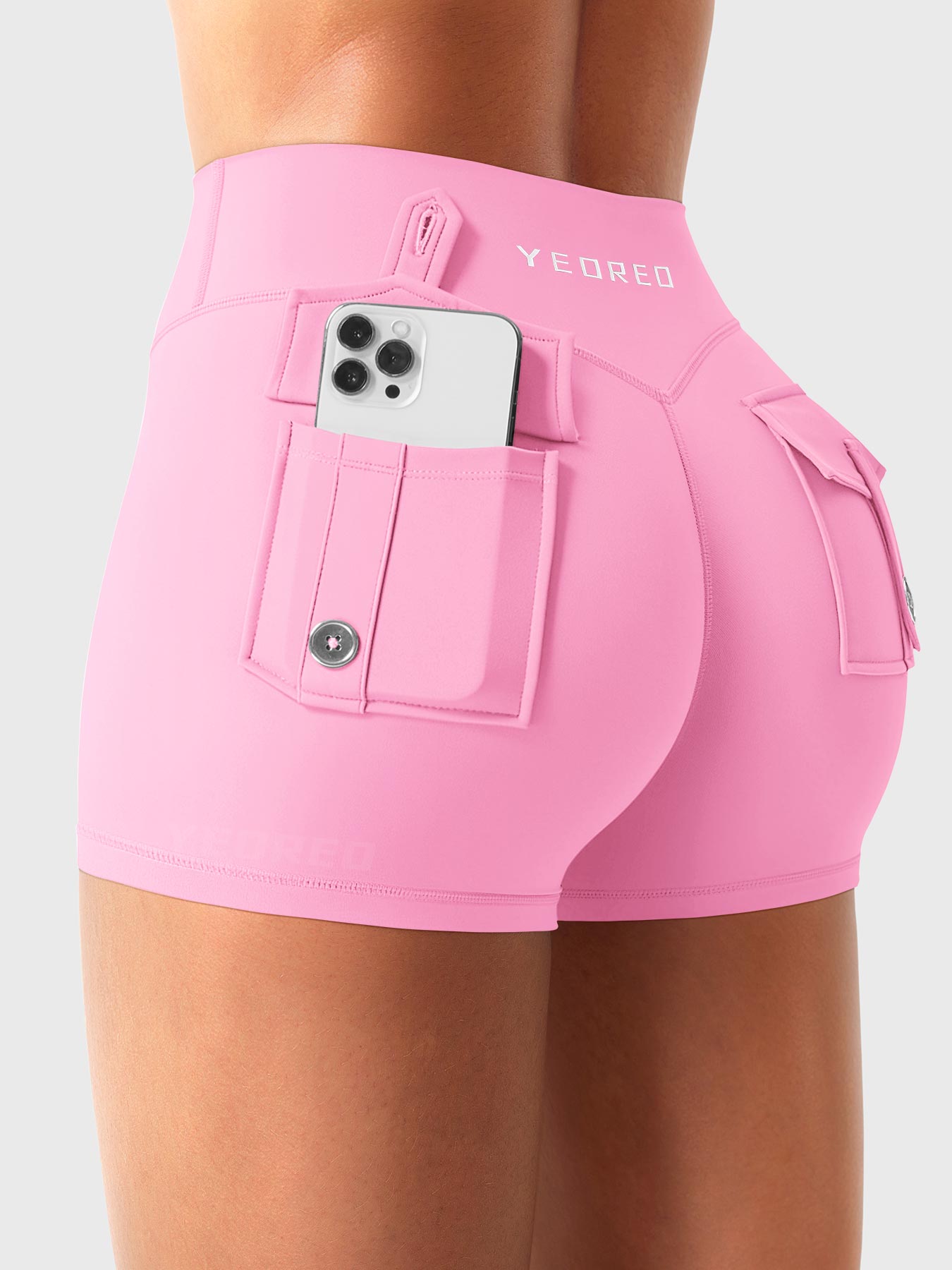 Bubblegum Pink Yeoreo Darilya CoreFlex low rise cargo shorts angled back view, rear cargo pockets for convenient storage