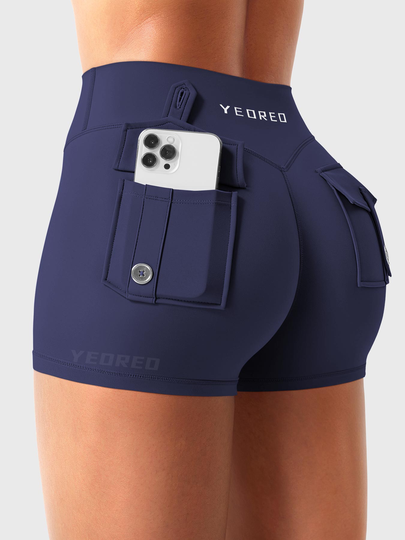Navy Yeoreo Darilya CoreFlex low rise cargo shorts angled back view, dual cargo pockets with functional utility design