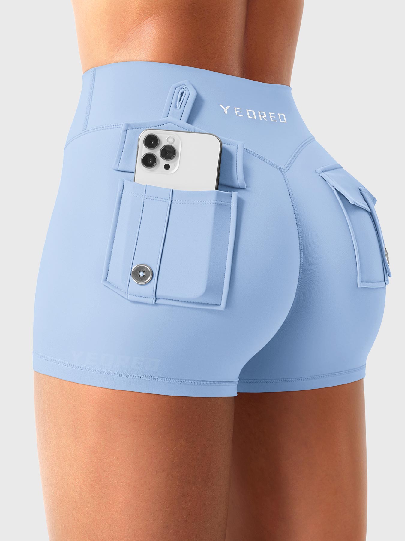 Light Blue Yeoreo Darilya CoreFlex low rise cargo shorts angled back view, dual rear cargo pockets with functional storage